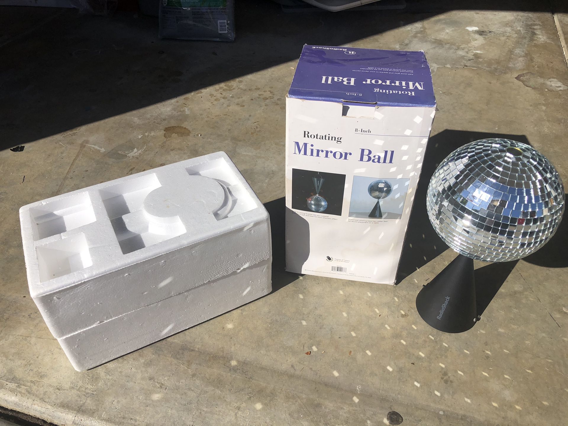 Rotating mirror ball, perfect shape. In original box with styrofoam clam shell for storage, perfect condition