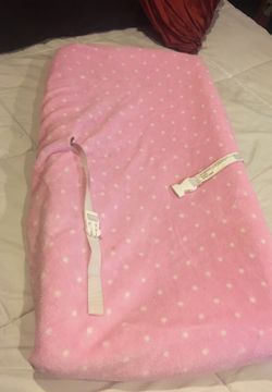 Baby changing table pad with pink cover