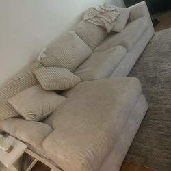 Couch, Bookshelf, Table, Paintings 