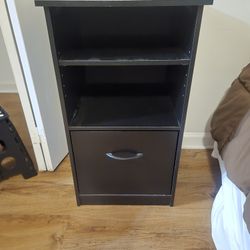 Black small book shelf and office table