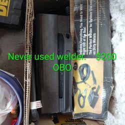   stick welder, likely a Chicago Electric or similar flux-cored arc welding machine