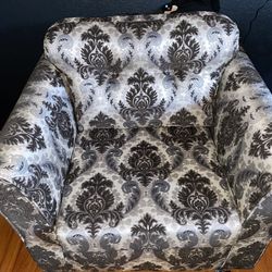 Vintage looking armchair with accompanying hassock
