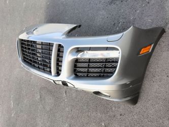 2003-2010 Porsche Cayenne complete front bumper with all the accessories OEM.