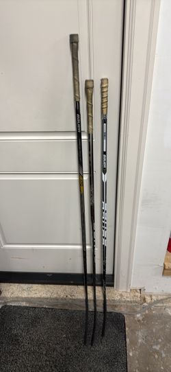 Three Bauer composite hockey sticks (Nexus/Vapor models)