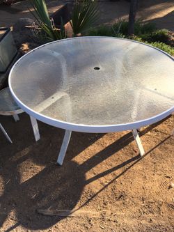 Glass top patio table and two side tables