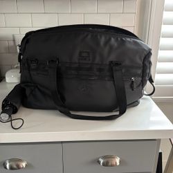 Mercedes Oakley Collab Travel Bag And Umbrella 