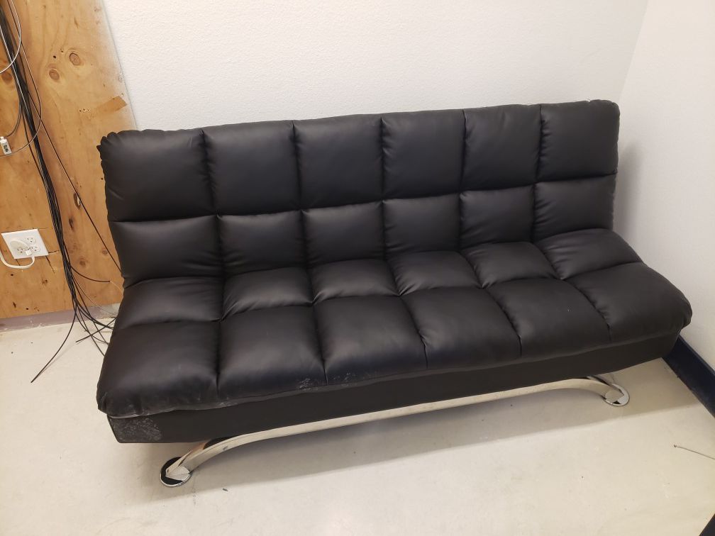 Futon couch/ bed . Practically new