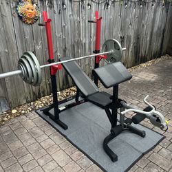 Complete 2” Olympic Style workout set with bench, squats and curl bench. 7’ bar and steel plates totaling 280 lbs. Everything in pics is Included