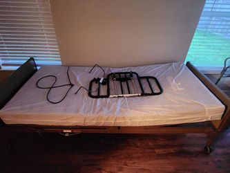 Hospital bed on wheels with side rails