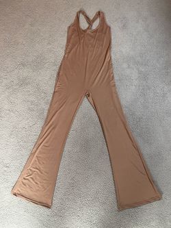 Tan jumpsuit with open back and flared legs. Size: L #jumpsuit #flaredleg #formal 18