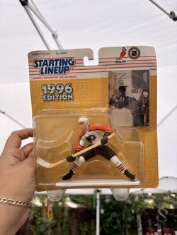 1996 Edition Starting Lineup sports superstar collectible featuring Eric Lindros of the Philadelphia Flyers