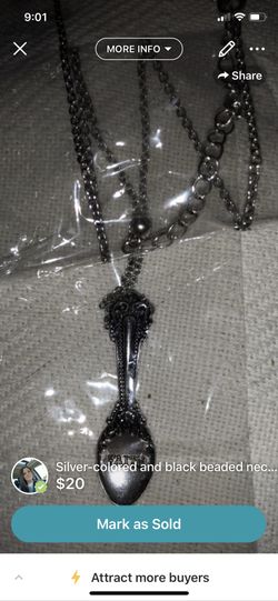 Silver – spoon necklace that says faith