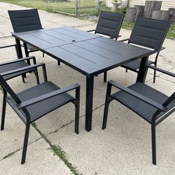 Outdoor patio dining set table with 6 oversized stacking sling chairs with padded back - Black