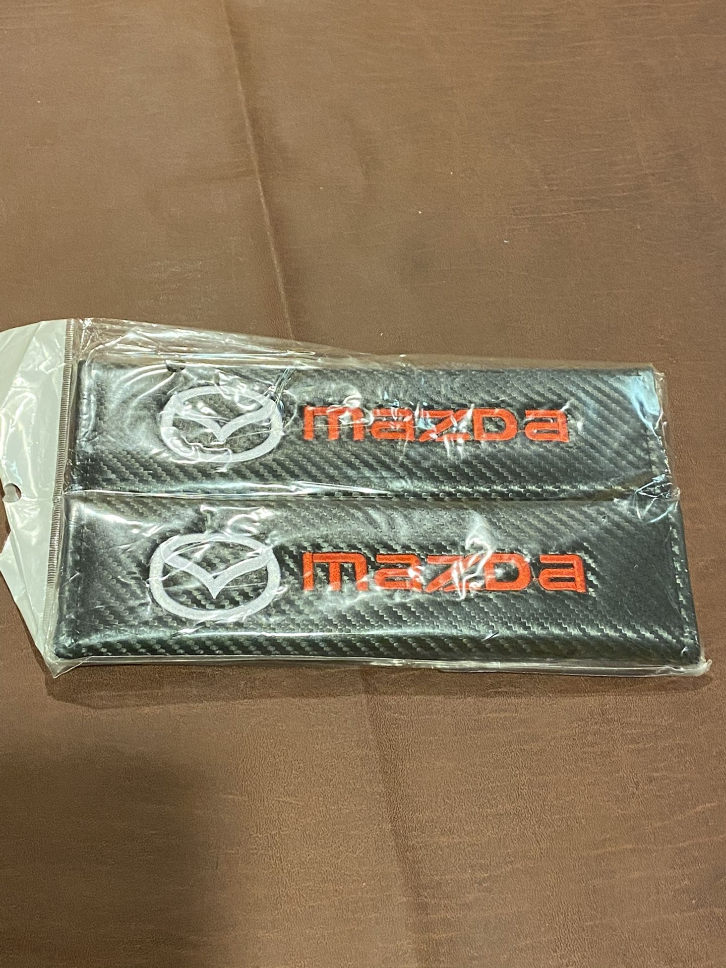 Brand New Mazda Seat Belt Pads