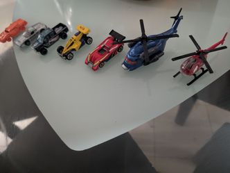 mixed lot of ~9 vehicles (cars, race cars, helicopters)