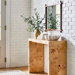 Console table adds functional style to your home Rectangle table fits along the wall Made with burled wood for visual appeal Forest Stewardship Counci