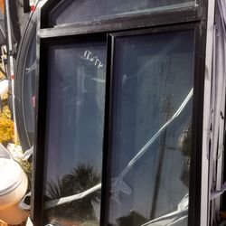 Milgard arch-top window in a modern black finish.