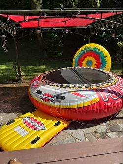 Inflatable dock bounce lounge towable 120 inches diameter with inflatable entry platform lightly used with smaller inflatble