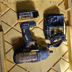 DeWalt 20 Volt Half Inch Impact Brushless It's Old Well Used I'm Not Sure How Long It'll Last It Works Good Though With A 5.0 Battery. Bt1,32, Firm