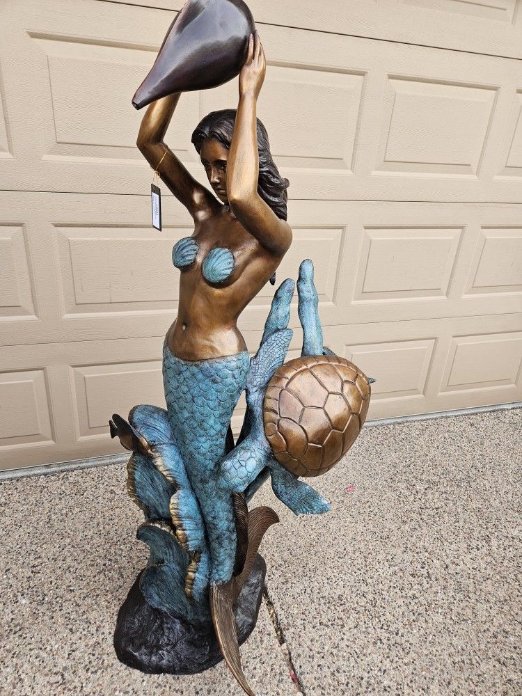 Bronze mermaid with turtles fountain