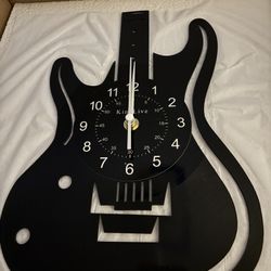  Guitar-shaped wall clock made from a recycled vinyl record