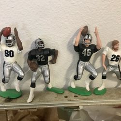 Four Vintage Raiders Action Figures