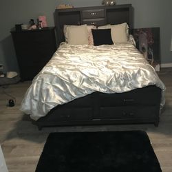 full bed frame with dresser and rug 