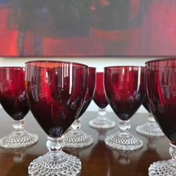 Set of 9 Anchor Hocking Bubble Foot Ruby red glass goblets for wine or water.