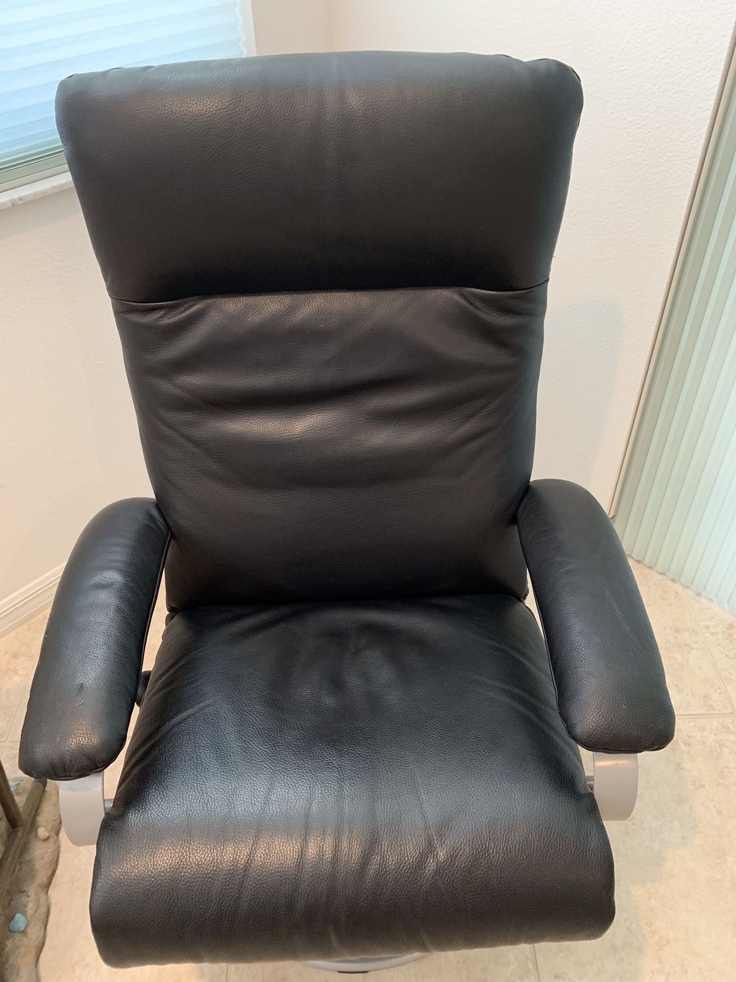 Black leather swivel & reclining chair