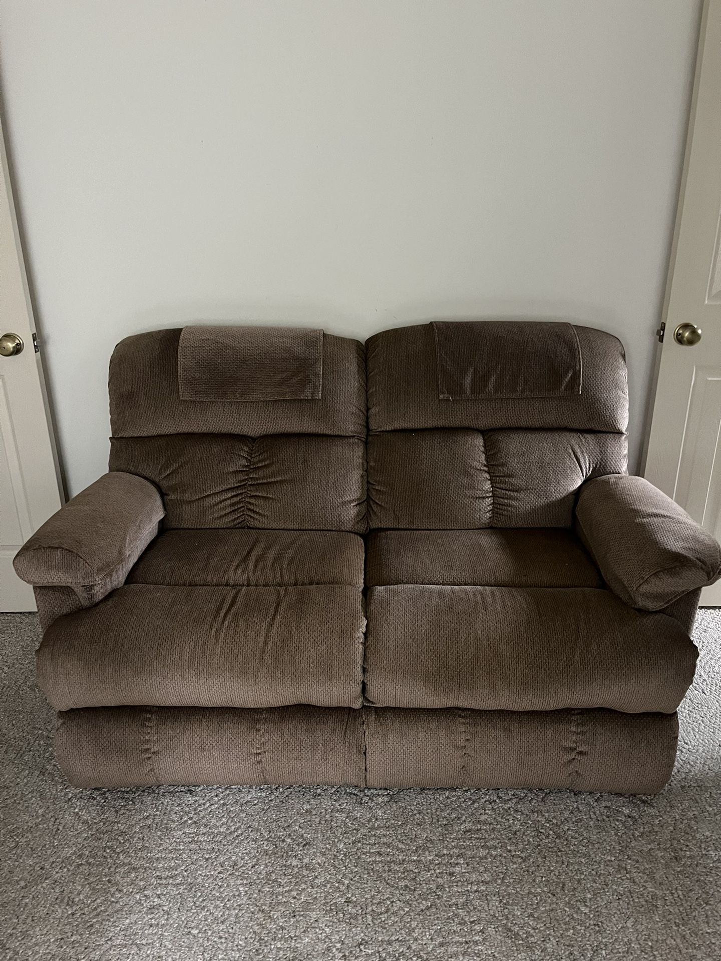 Tan Reclining Loveseat 