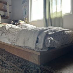 Selling wooden bed frame and queen mattress combo!