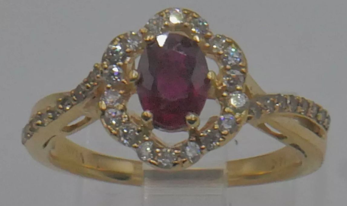 LEVIAN 14KT YELLOW GOLD RING SIZE 7 3.7 GRAMS WITH RUBY 6.7MM X 4.9 MM X 3.2 MM HAS SOME SCRATCHES AND UNPERFECTIONS AND 18 DIAMONDS 2.5 PTS SI1 G