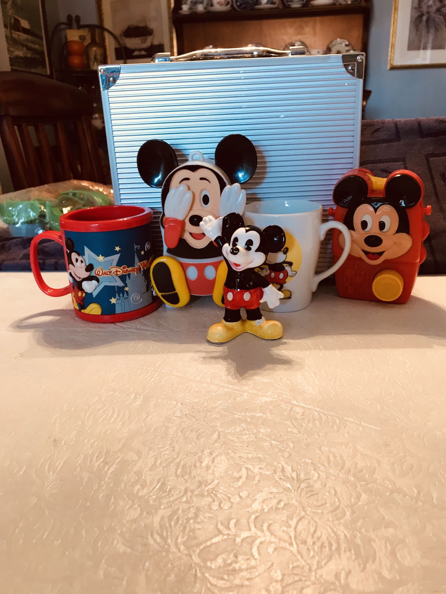 Assortment of Vintage Mickey Mouse items, the musical toys, 2 cups one ceramic the other one thick plastic and a ceramic figure (price is for all)