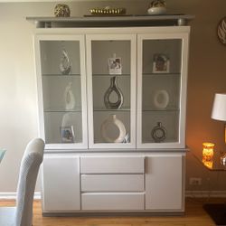 Dining room cabinet with table and four chairs