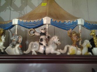 Cute half carousel colle table nice for childs room hangs like a picture but it 3 d