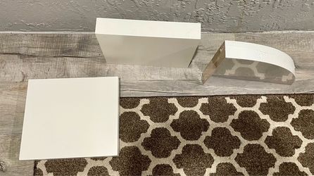 IKEA white floating shelves and corner shelf