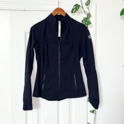 Lululemon Black Tech-Performance Zip Jacket - Women’s size 8 Sleek black zip-front jacket with a fitted silhouette. Lightweight, stretchy fabric for e