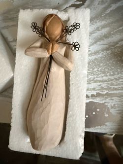 Willow Tree Friendship Figurine   Hand-painted Willow Tree Friendship figurine is made of resin and features a woman holding a bouquet of wire flowers