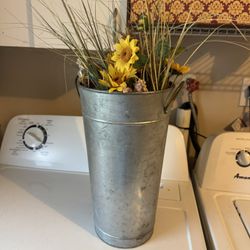 Galvanized pot with beautiful, fake flowers