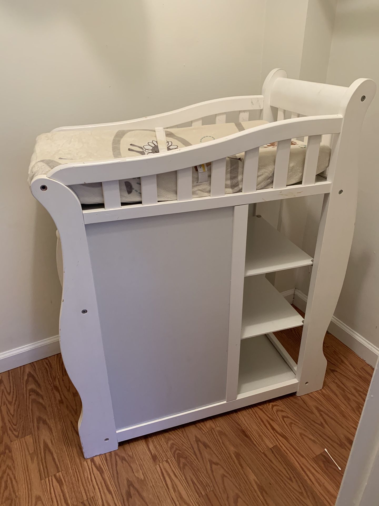 Diaper changing station with changing pad and cover