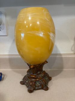 Amber Marbled plastic Egg on Ornate Metal Stand
