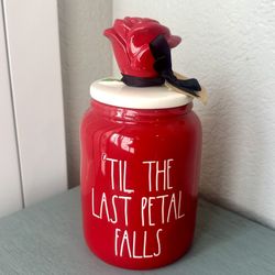 $25.New Disney Rae Dun ‘TIL THE LAST PETAL FALLS canister. Measures 8” tall and 4”!diameter.  Please pickup in the area of 36th Are and Pinnacle peak 