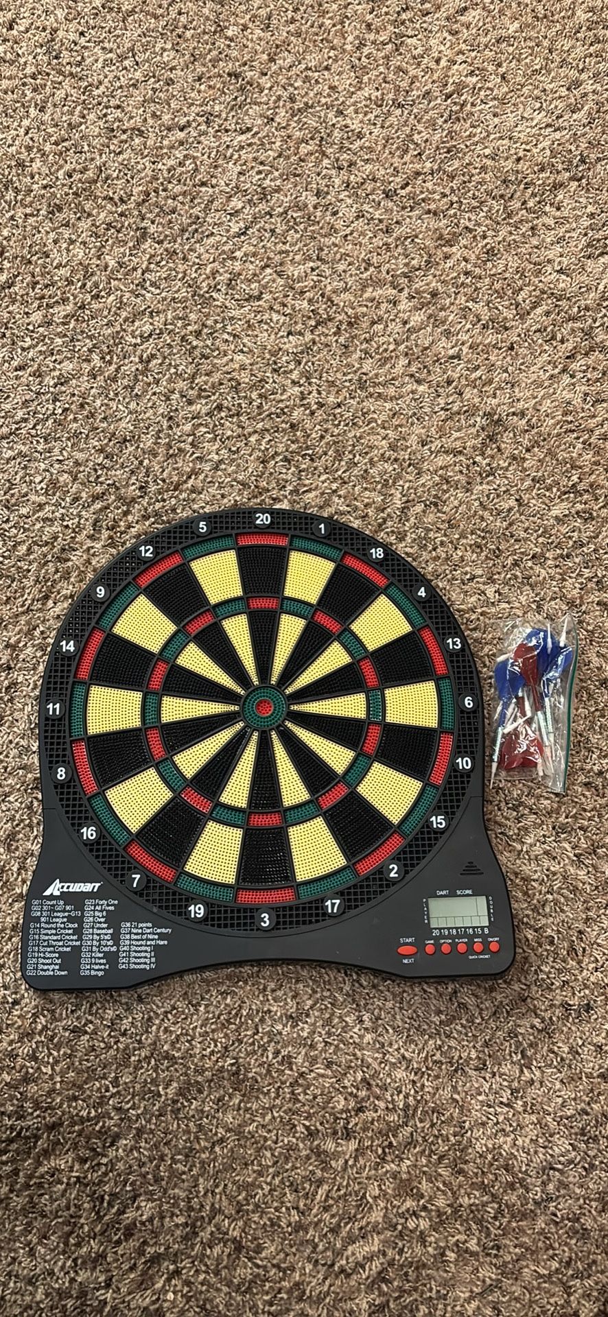 Electronic Dart Board with many darts.