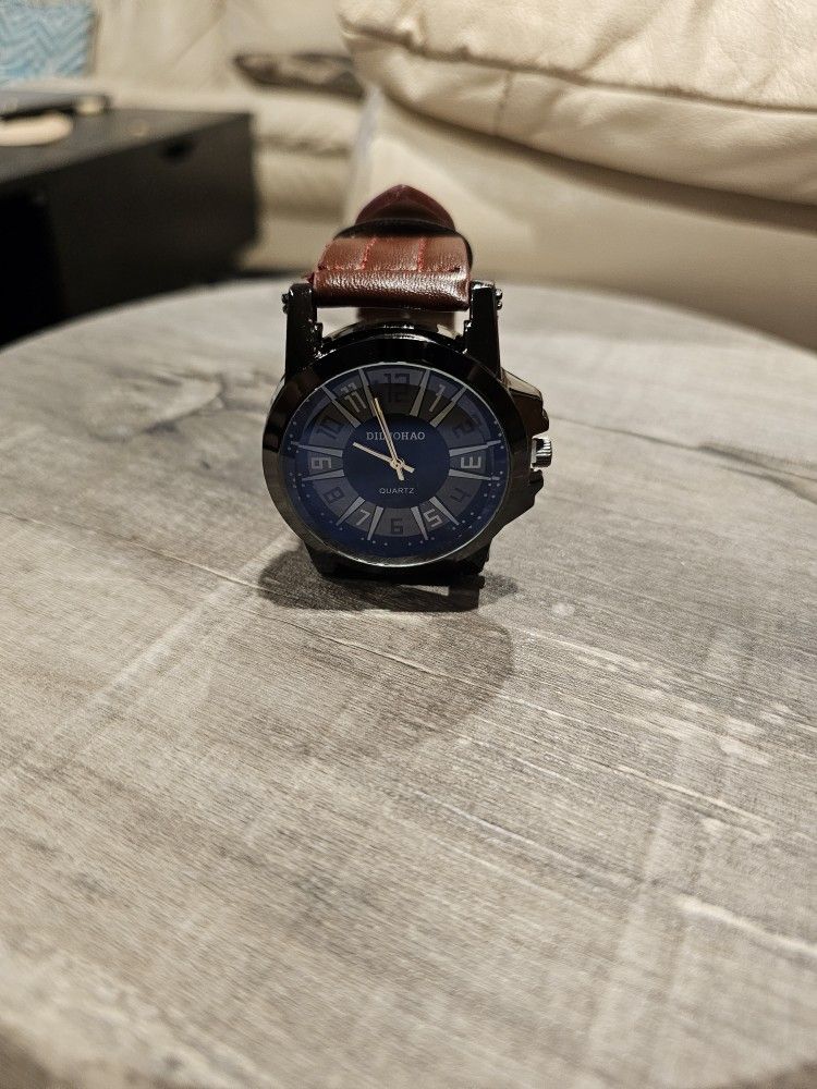 Thick Black And Blue Watch With Brown Wristband