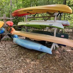 Heritage Merlin 14’ touring Kayak With Overnight Storage (Second From The Bottom )