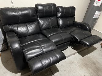 Black leather power reclining sofa