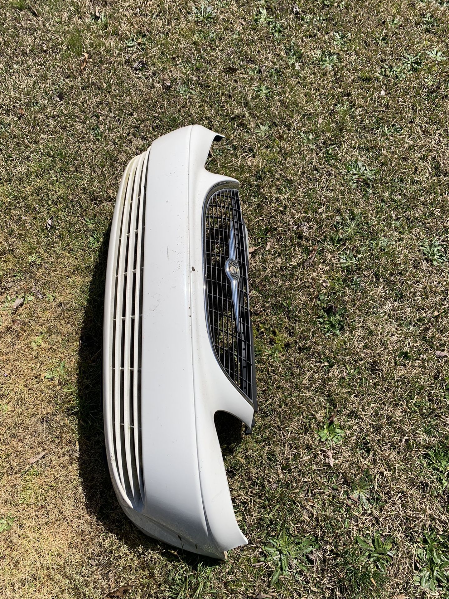 Town And Country Grille And Bumper Cover