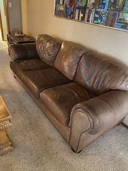 Worn leather couches