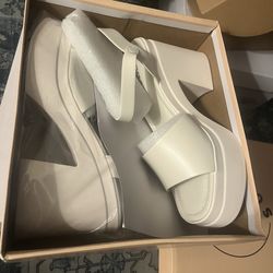 White/Ivory heels size 10. Never worn.