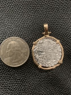 Atocha silver coin pendant in gold bezel